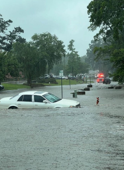 car in road flooded