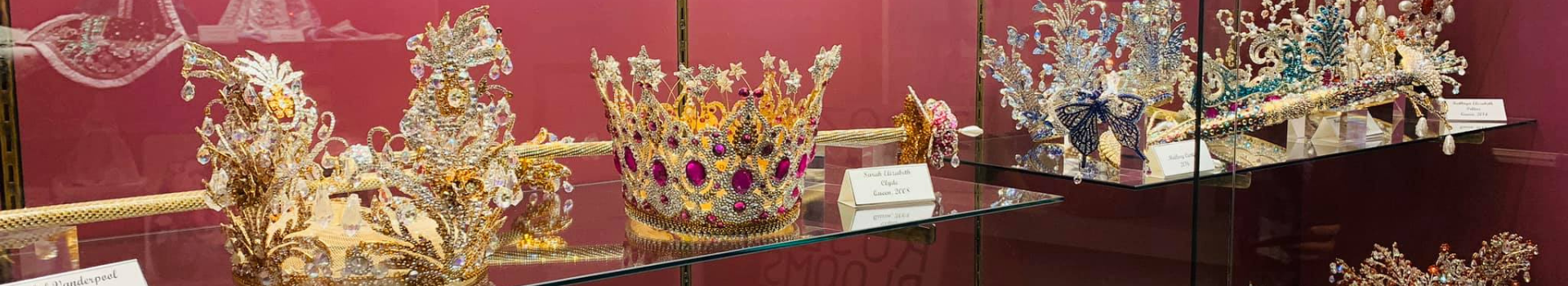 Display of past Rose Festival Queen's Crowns in the Tyler Rose Museum