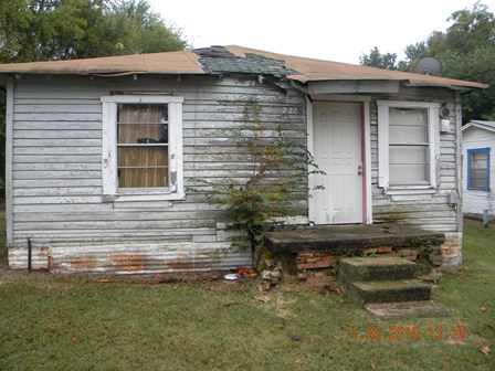 House with rot and collapsing roof