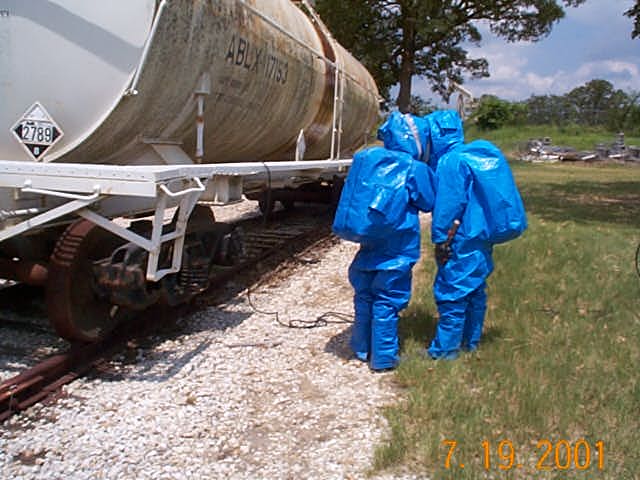 Blue-suited HAZMAT technicians