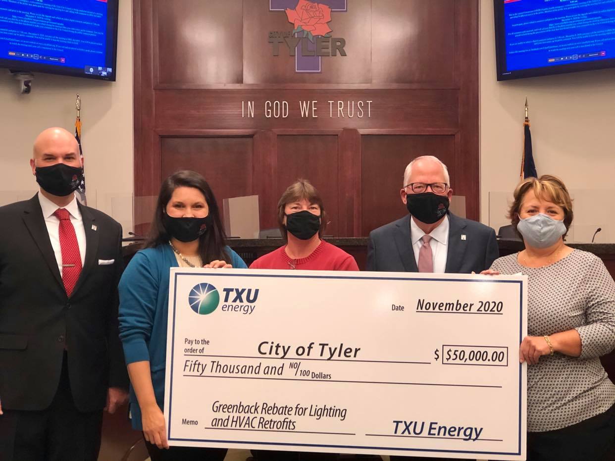 TXU presents Main Street with check